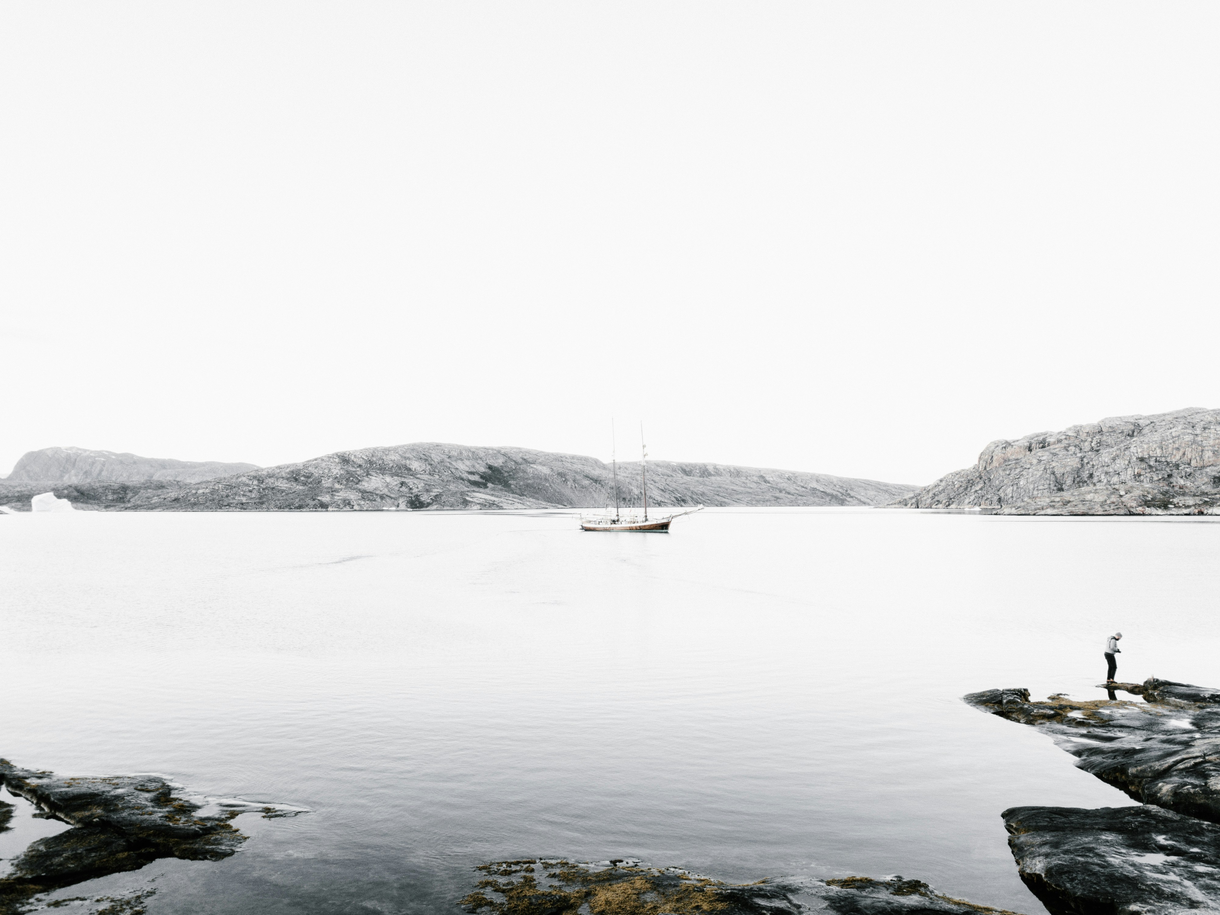 boat on body of water near island